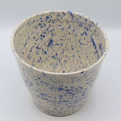Speckled ceramic planter with blue and cream speckled pattern on a white background